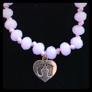 “It’s a girl” glass bead pull cord bracelet